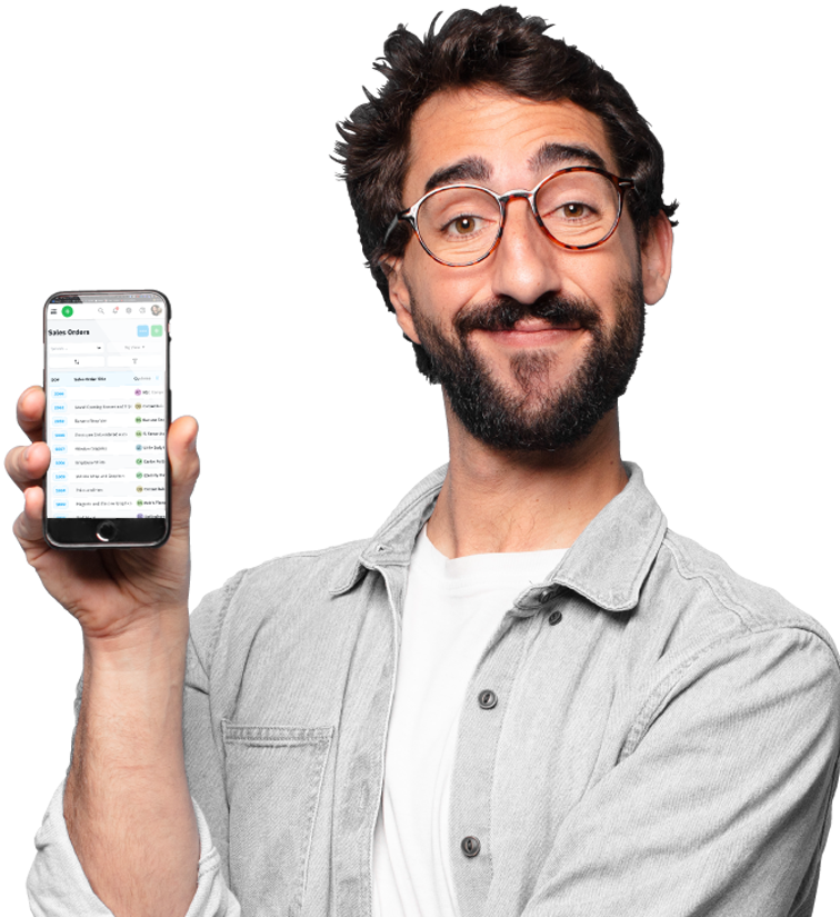 Man smiling and holding a smartphone displaying an app