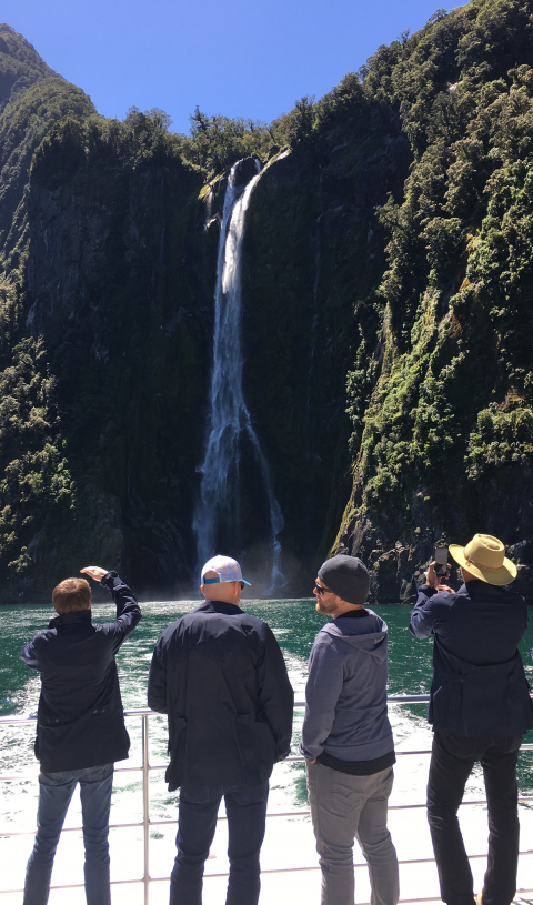 shopVOX employees looking at a waterfall.