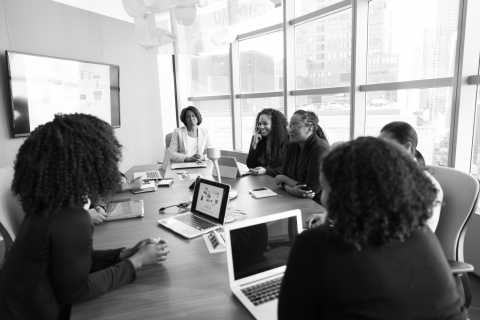 Group of business women in a meeting.